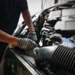 Mechanic looking at a car engine