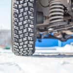 Tire on an SUV Driving on Snow