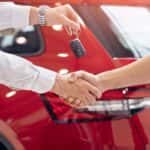 Trading In a Vehicle Concept With People Shaking Hands