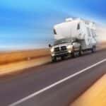 Truck pulling a trailer on a highway
