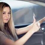 Young Woman Driving in a Car