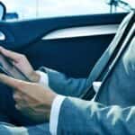 Young business professional using a tablet at Thompson Sales