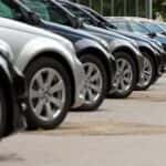 Row of many cars for sale on a car lot