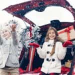 Two girls travel with Christmas presents in the trunk of their car