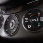 Air conditioning control panel on vehicle dashboard
