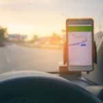 Traffic app on dashboard as car goes down a highway