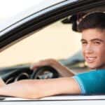 Teenage boy getting ready to drive a car