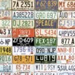 Collage of American license plates on a wall