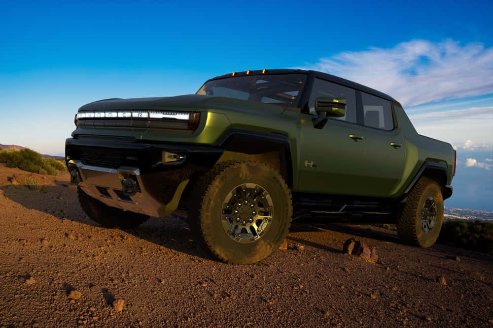 Green GMC Hummer EV off-roading