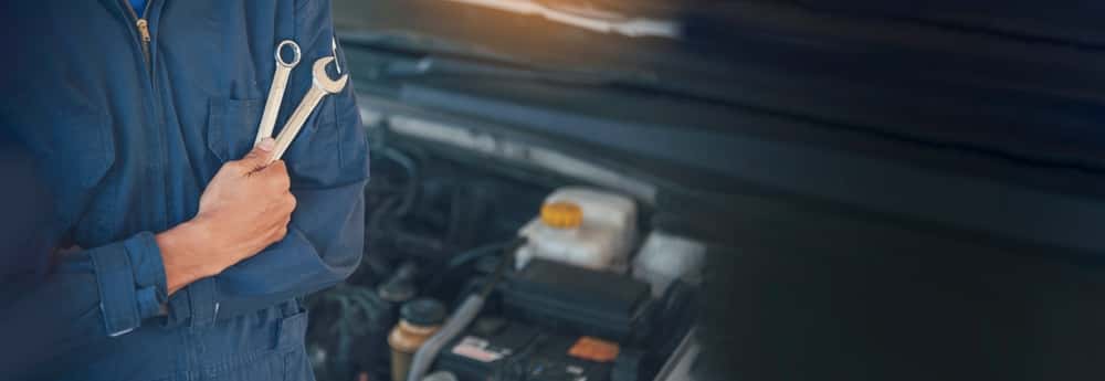 Close-up of a mechanic about to perform car maintenance