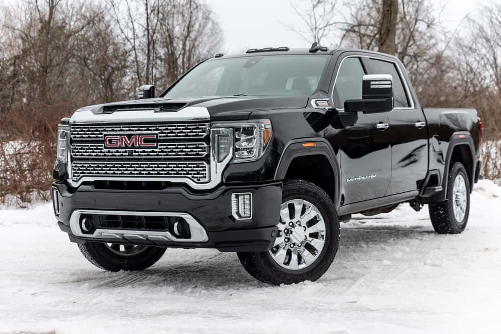 A GMC truck parked in the snow