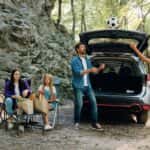 A family on a camping trip in their used SUV