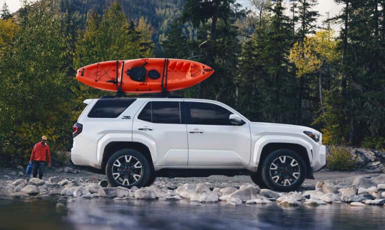2025 Toyota 4Runner Exterior On Rocky Shore With Kayak