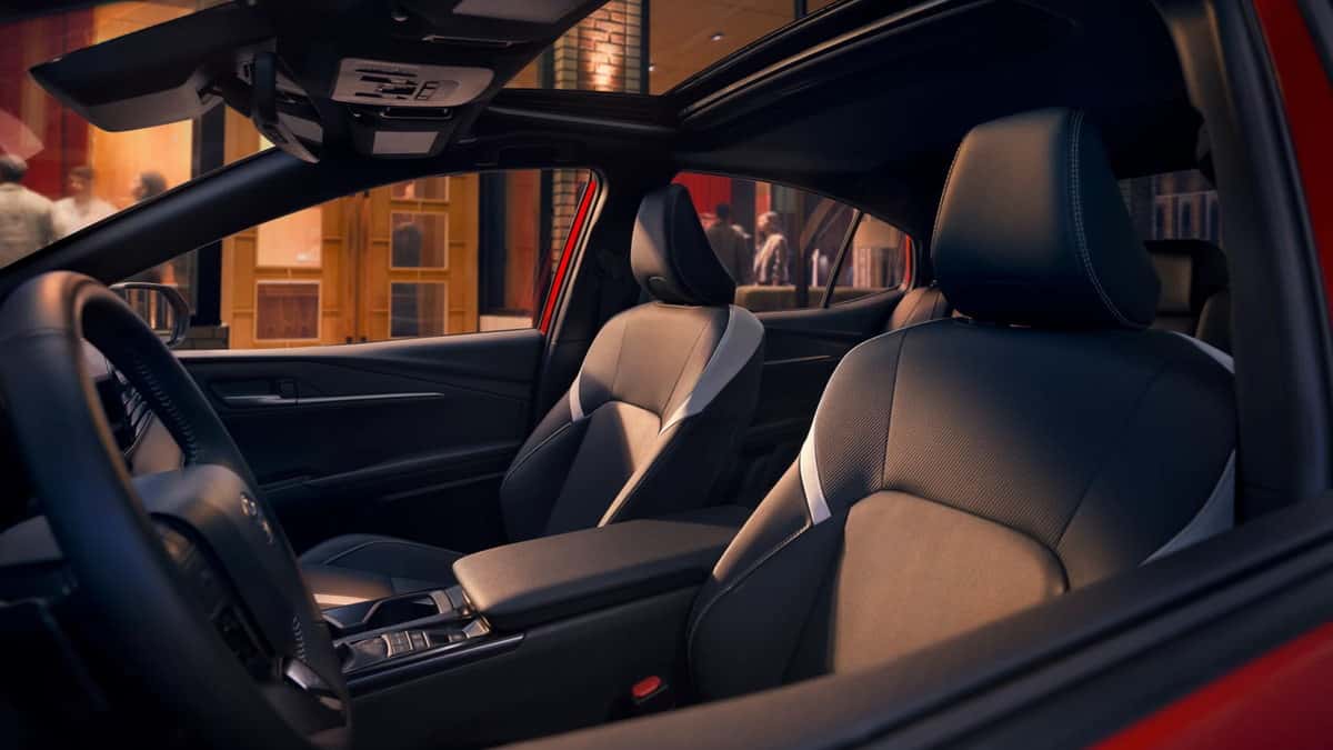 2026 Toyota Camry Hybrid interior showing front seats, center console and steering wheel
