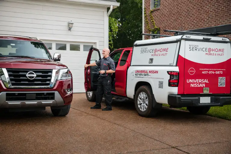 Universal Nissan Service at Home mobile service truck at a customer's driveway in Orlando FL