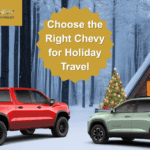 Chevy Silverado and Chevy Equinox parked in front of a snowy cabin, perfect vehicles for holiday road trips and winter driving
