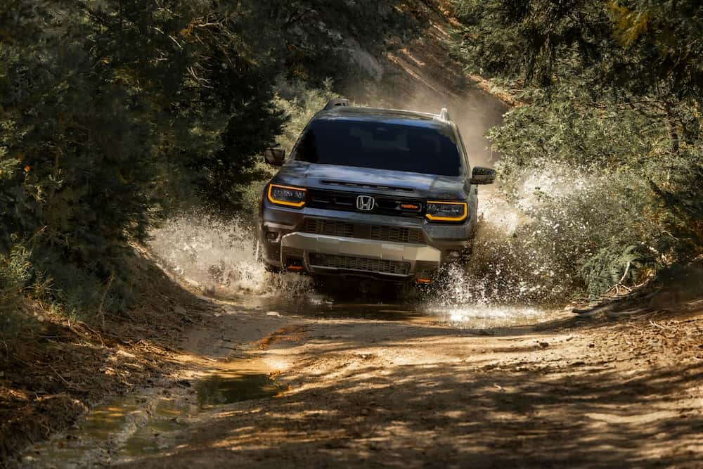 2027 Honda Passport TrailSport on a dirt road