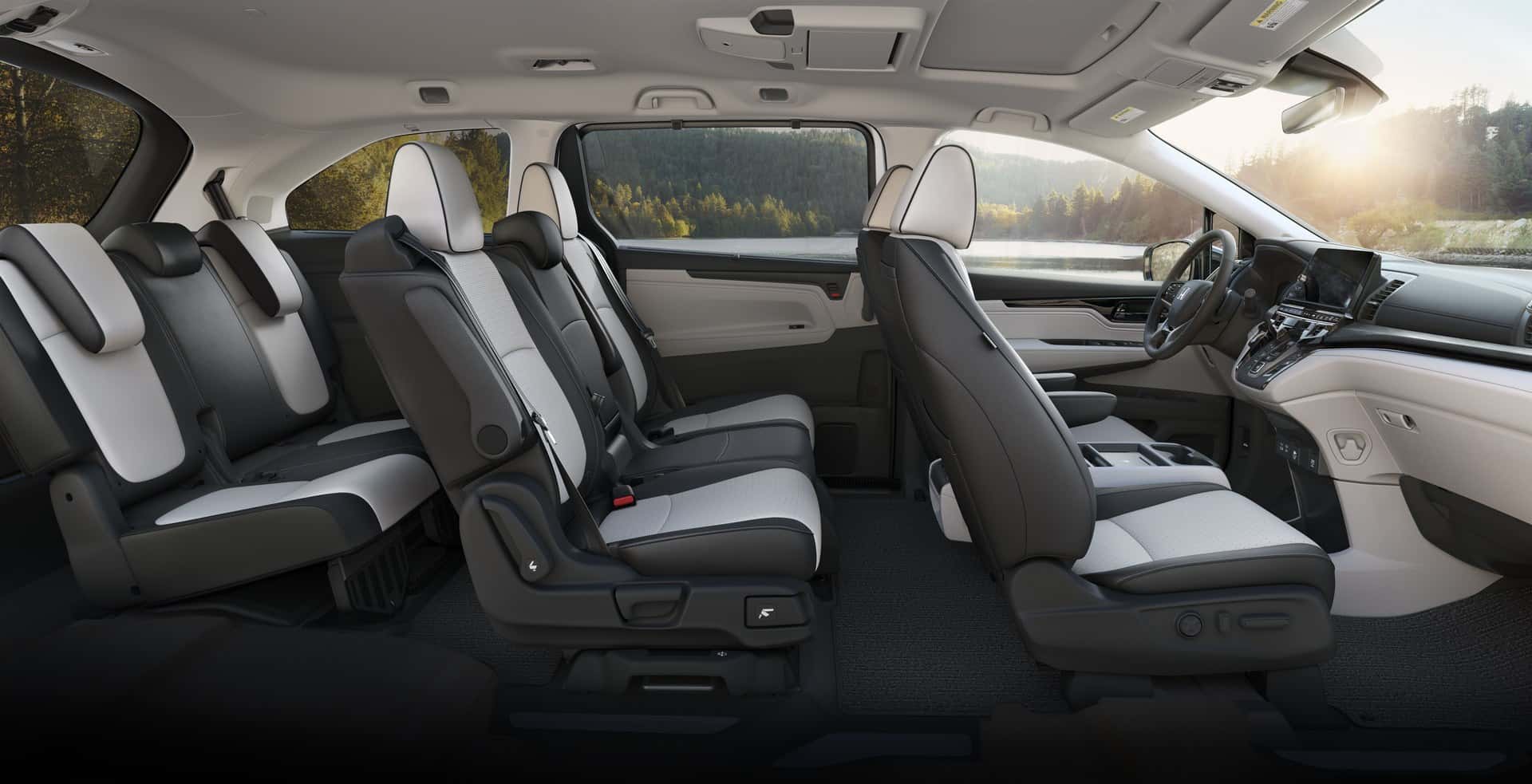 Side-view cutaway of a Honda Odyssey interior showing the front seats, second row, and third row