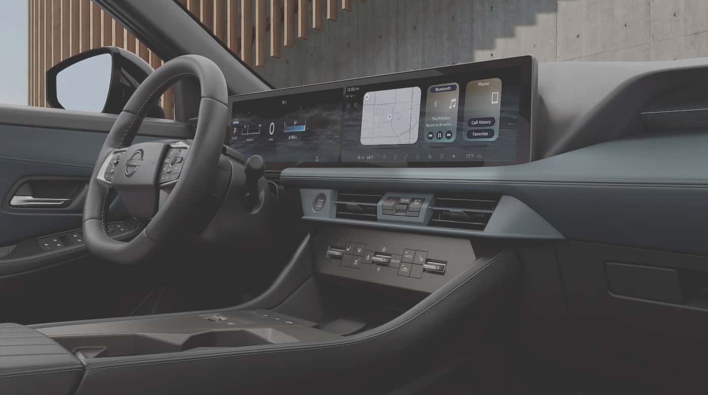 2027 Nissan Rogue Hybrid dashboard with physical climate control buttons below dual 14.3-inch displays
