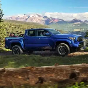 2025 Toyota Tacoma in Blue Passenger Side View Carrying Mountain Bikes