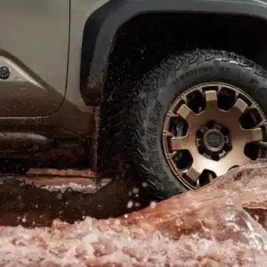 2025 Toyota Tacoma Trailhunter closeup of Tire Driving Through Water