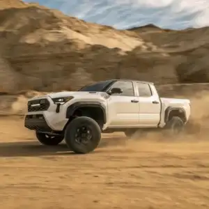 2025 Toyota Tacoma White Driver Side View Driving Off Road