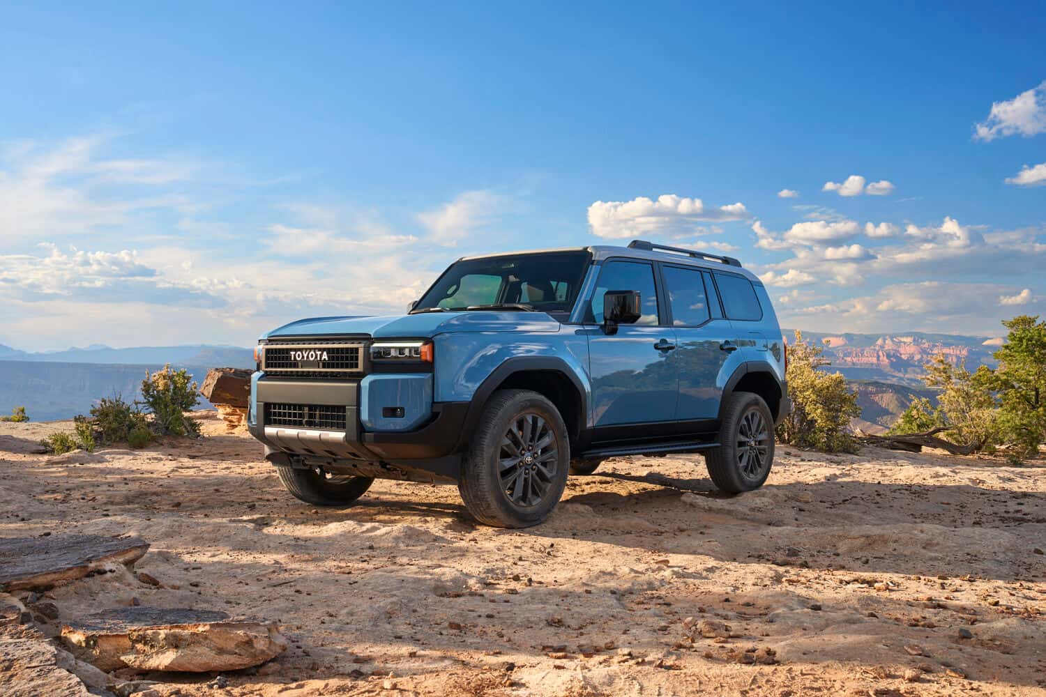 2025 Toyota Land Cruiser Heritage Blue in the mountains