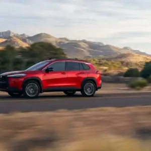 2026 Toyota Corolla Cross Soul Red Crystal in motion