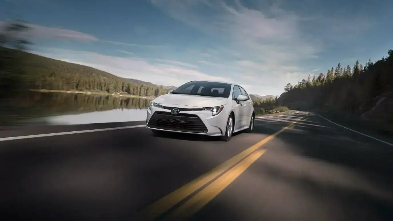 https://di-uploads-pod47.dealerinspire.com/valleyhitoyota/uploads/2025/10/2026-toyota-corolla-front-end-view-driving-on-road.webp