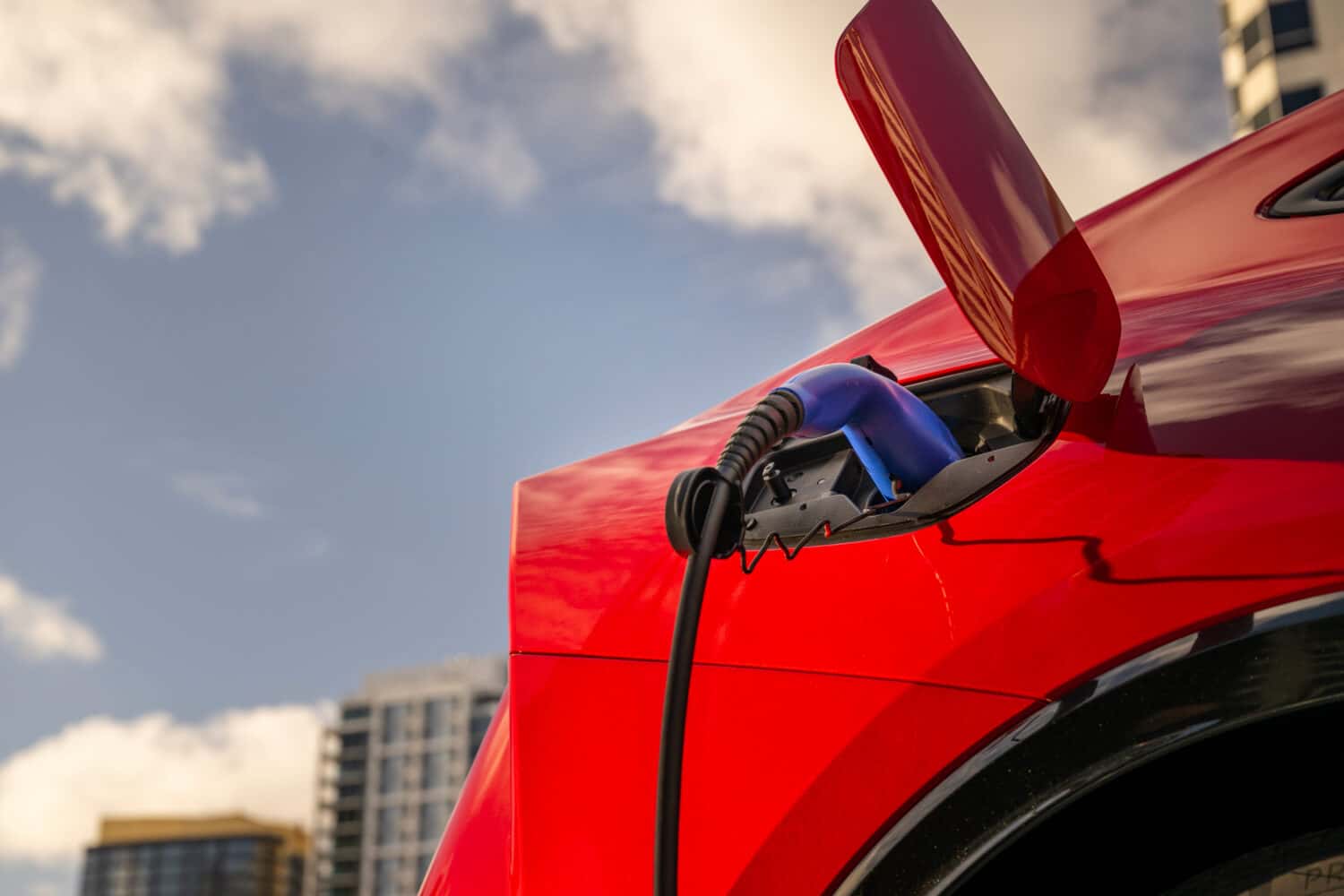 2026 Toyota Prius PHEV Supersonic Red charging