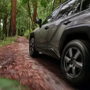 2026 Toyota RAV4 Hybrid Driving through the Woods