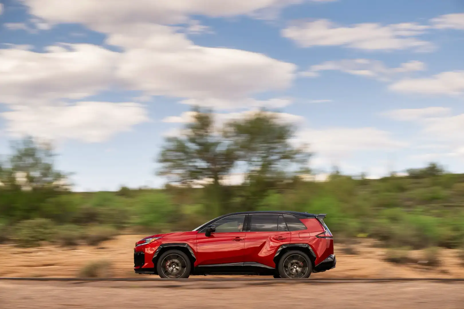 Red 2026 Toyota Rav4 GR Sport driving off road