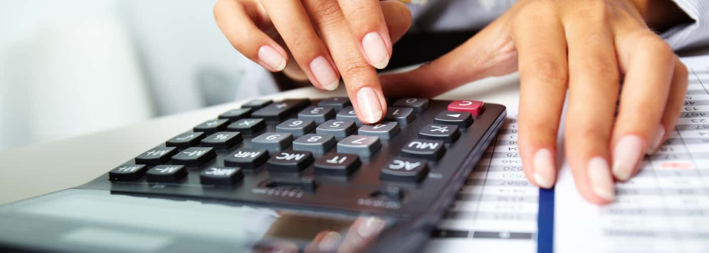 hands-doing-calculations-with-calculator