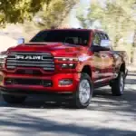 A red RAM 2500 driving down the road