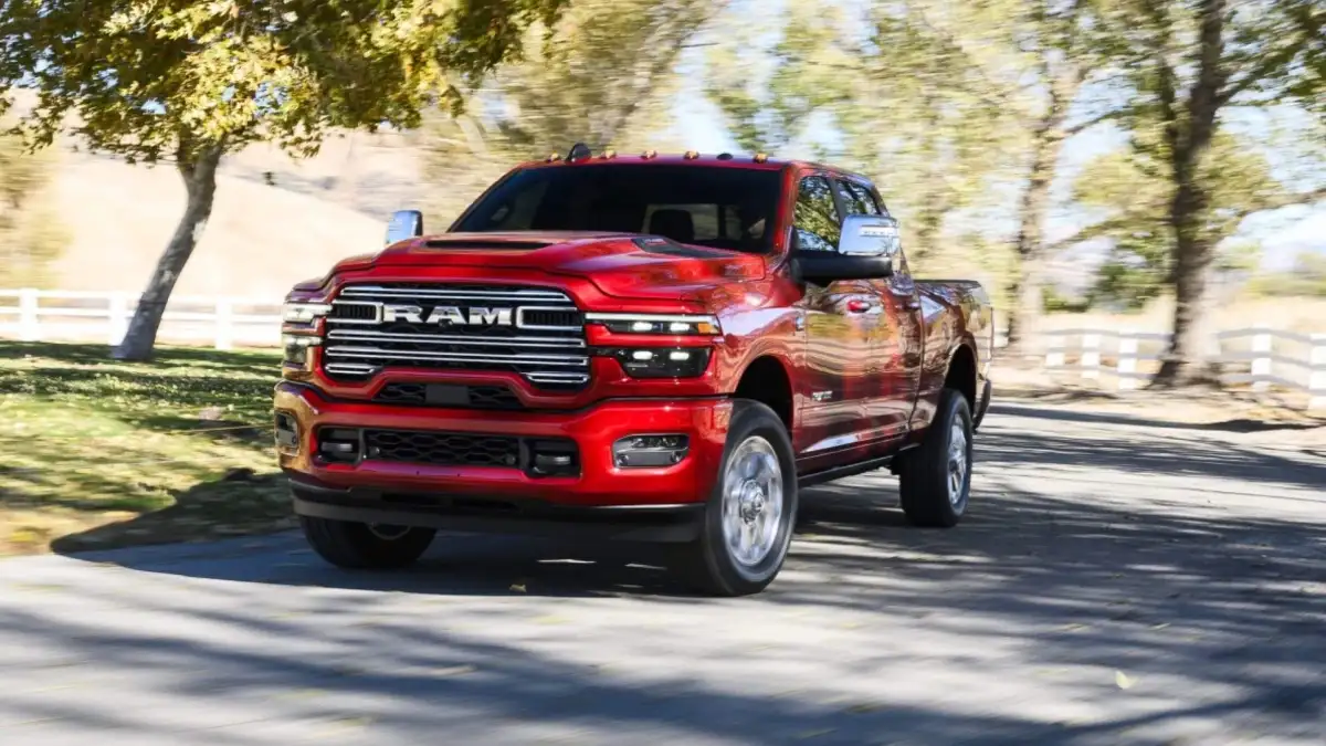 A red RAM 2500 driving down the road