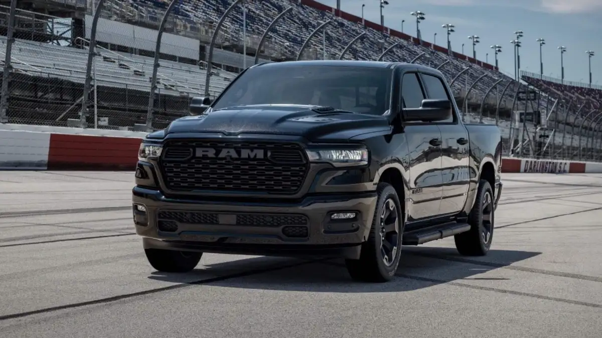 A black RAM 1500 on a race track