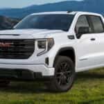 White 2024 GMC Sierra 1500 parked on grass