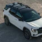 White 2025 GMC Terrain AT4 parked at a GMC dealer near Champaign
