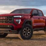 Red 2026 GMC Canyon AT4X for sale parked off-road