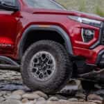 Close-up of the front wheel on a red 2026 GMC Canyon AT4X.