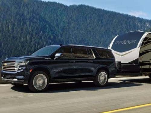 2023 Chevrolet Suburban towing a camper