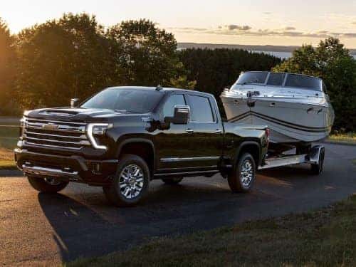 2024 Chevrolet Silverado HD towing a boat