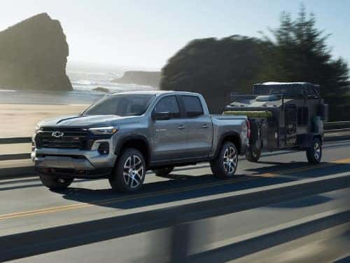 2024 Chevrolet Colorado towing a small enclosed trailer