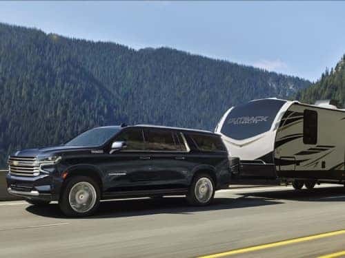 2024 Chevrolet Suburban towing a trailer