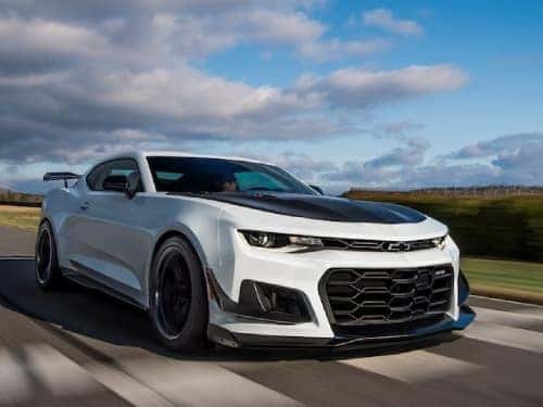 2024 Chevrolet Camaro driving fast on a road