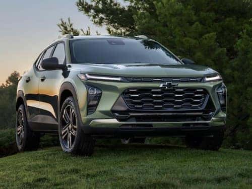 2025 Chevrolet Trax parked on a grassy hill