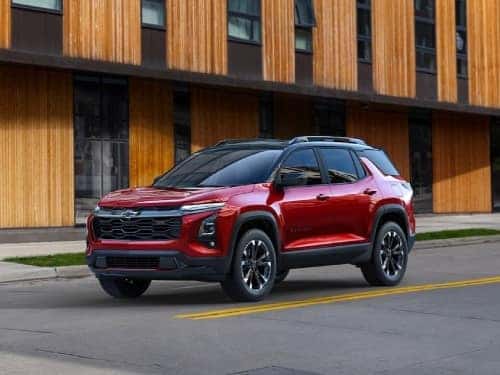 2025 Chevrolet Equinox driving down a city street