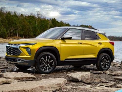 2025 Chevrolet Trailblazer ACTIV parked on a rocky area next to a lake