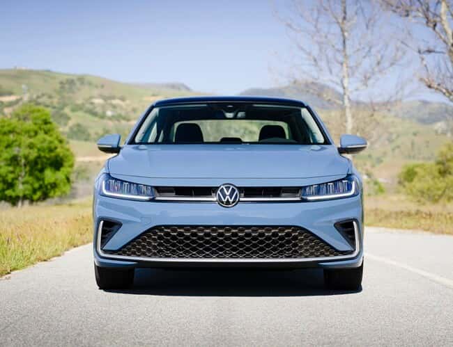 Front view of VW Jetta parked on scenic road from Used car dealer near Inver Grove Heights