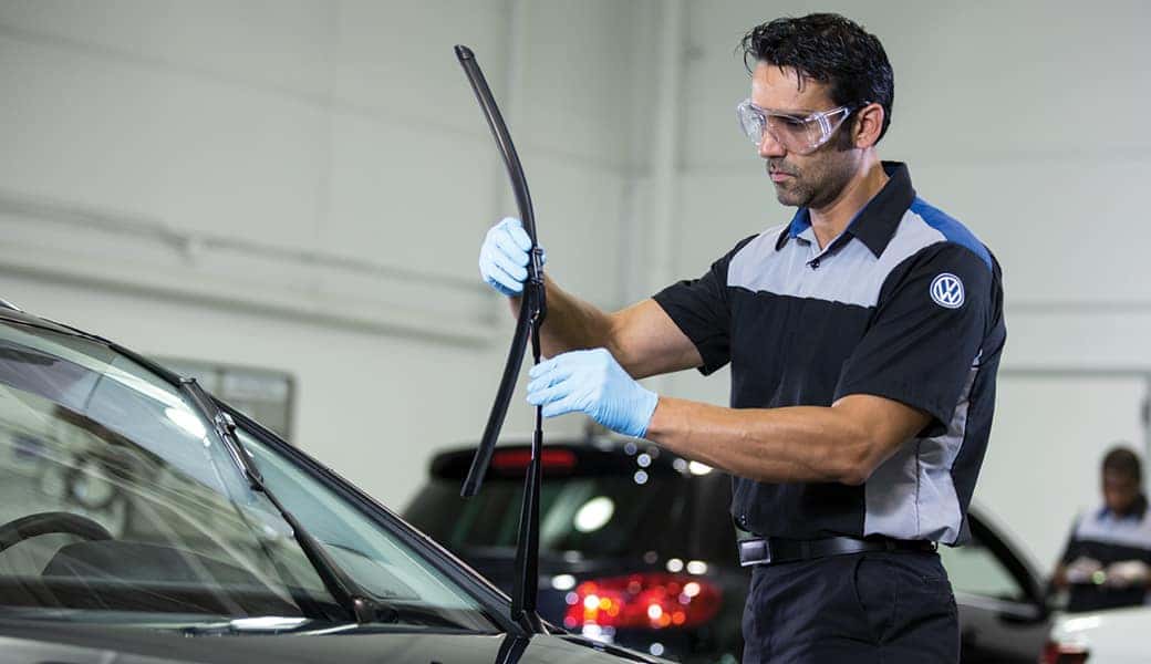 Mechanic changing windshield wiper
